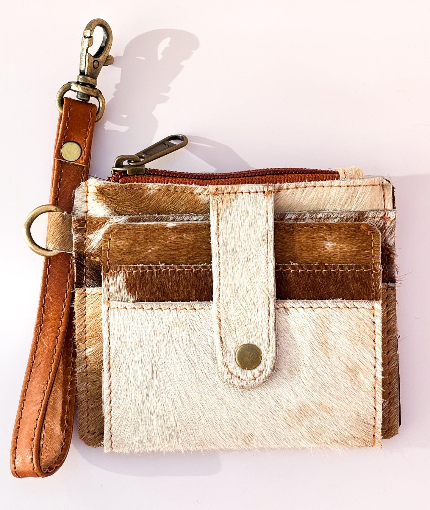 Saddle Drift Wallet- Genuine Hair on Hide leather- features detachable wrist strap, credit card slot, ID card slot and zipper