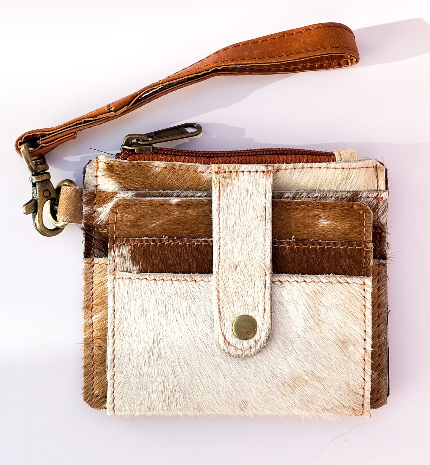 Saddle Drift Wallet- Genuine Hair on Hide leather- features detachable wrist strap, credit card slot, ID card slot and zipper