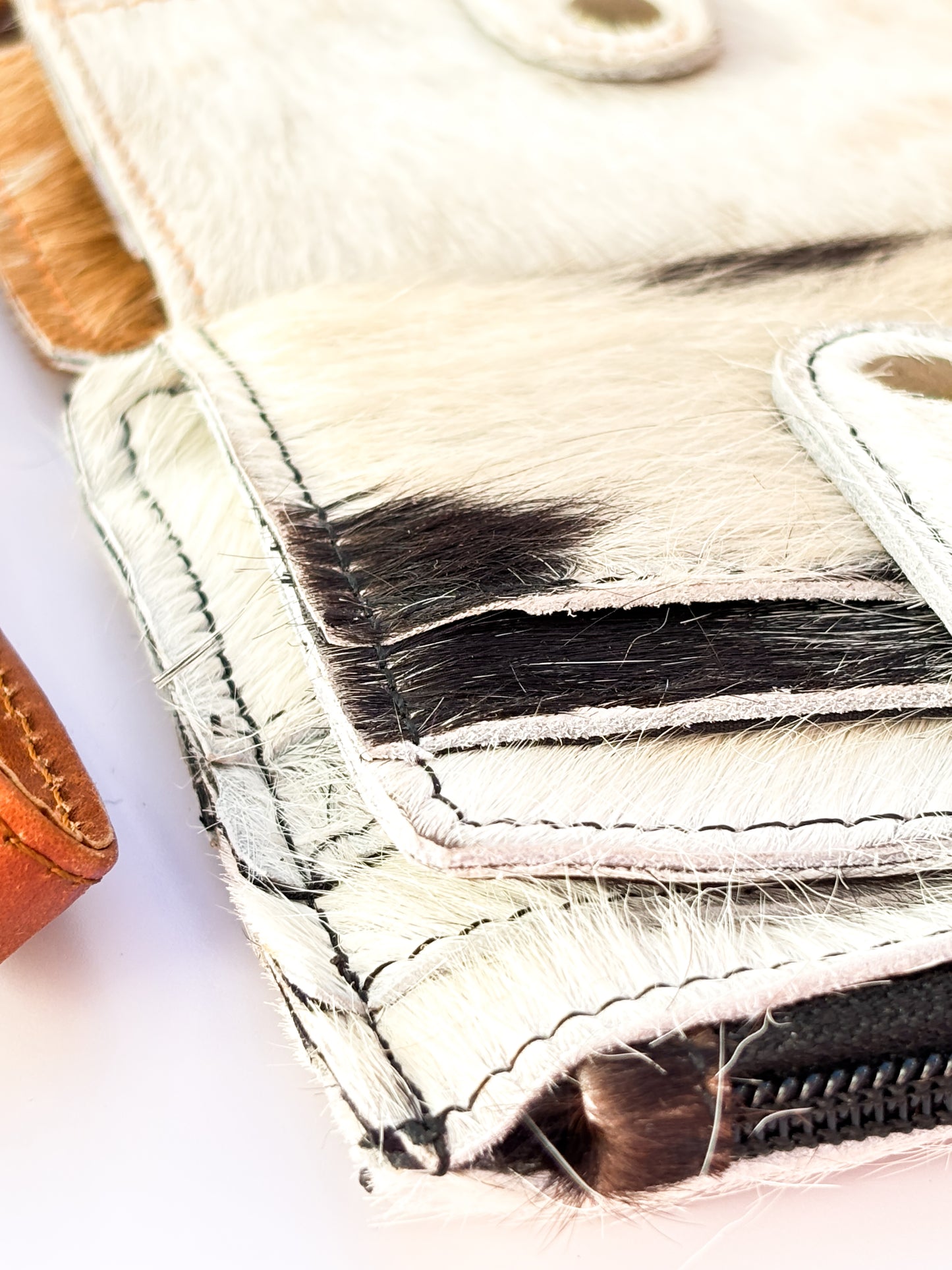 Saddle Drift Wallet- Genuine Hair on Hide leather- features detachable wrist strap, credit card slot, ID card slot and zipper